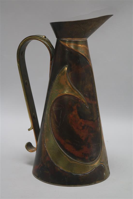 An Arts & Crafts style copper ewer